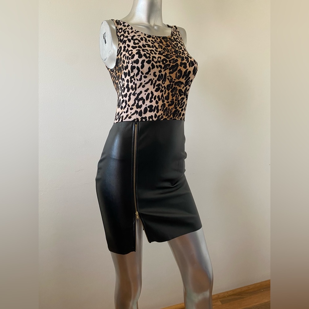 Size Small, leopard pattern on top with Black expandable fake leather  bottom.